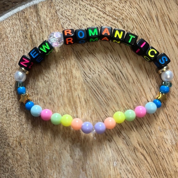 5 for $20 Taylor Swift Handmade Friendship Beaded Bracelet
“New Romantics” - Picture 1 of 2